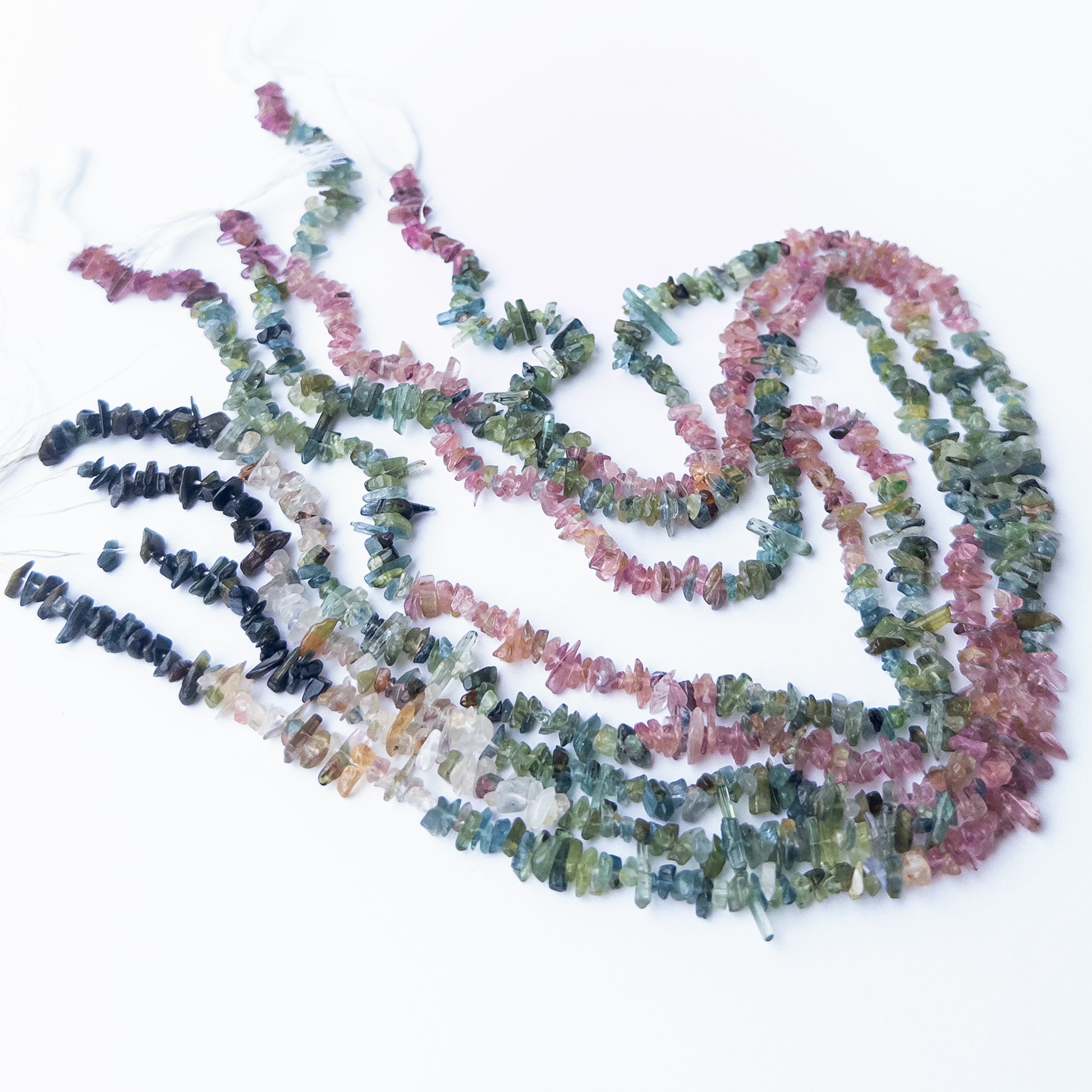 Multi Tourmaline chips and nuggets displaying vibrant colours and natural texture in a detailed strand.