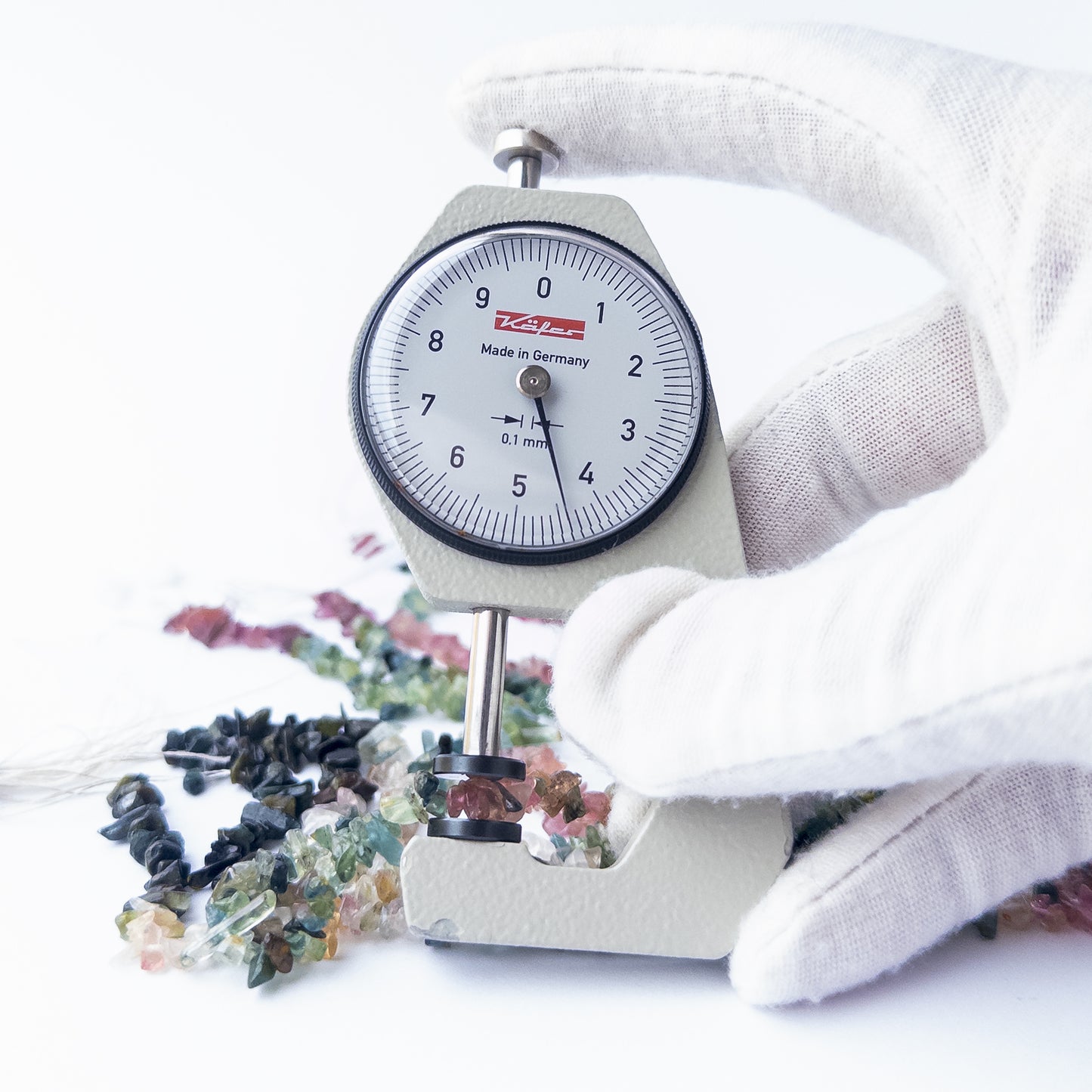 A dial gauge measures the Multi Tourmaline chips and nuggets 3–4mm gemstone.  