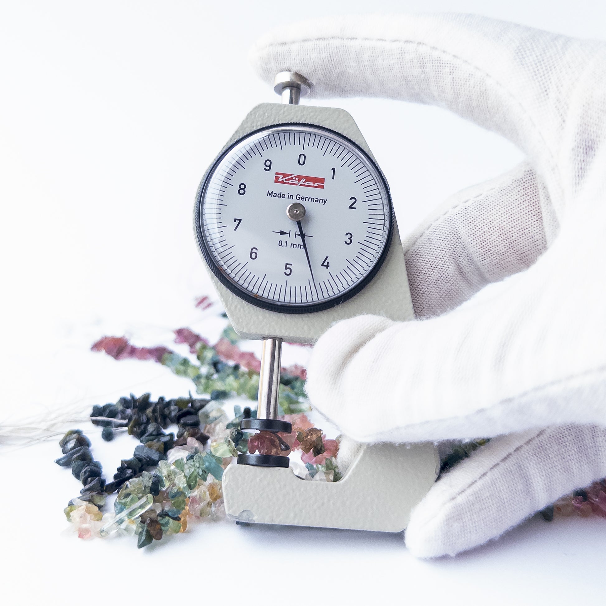 A dial gauge measures the Multi Tourmaline chips and nuggets 3–4mm gemstone.  