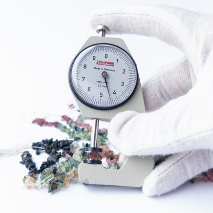A dial gauge measures the Multi Tourmaline chips and nuggets 3–4mm gemstone.  
