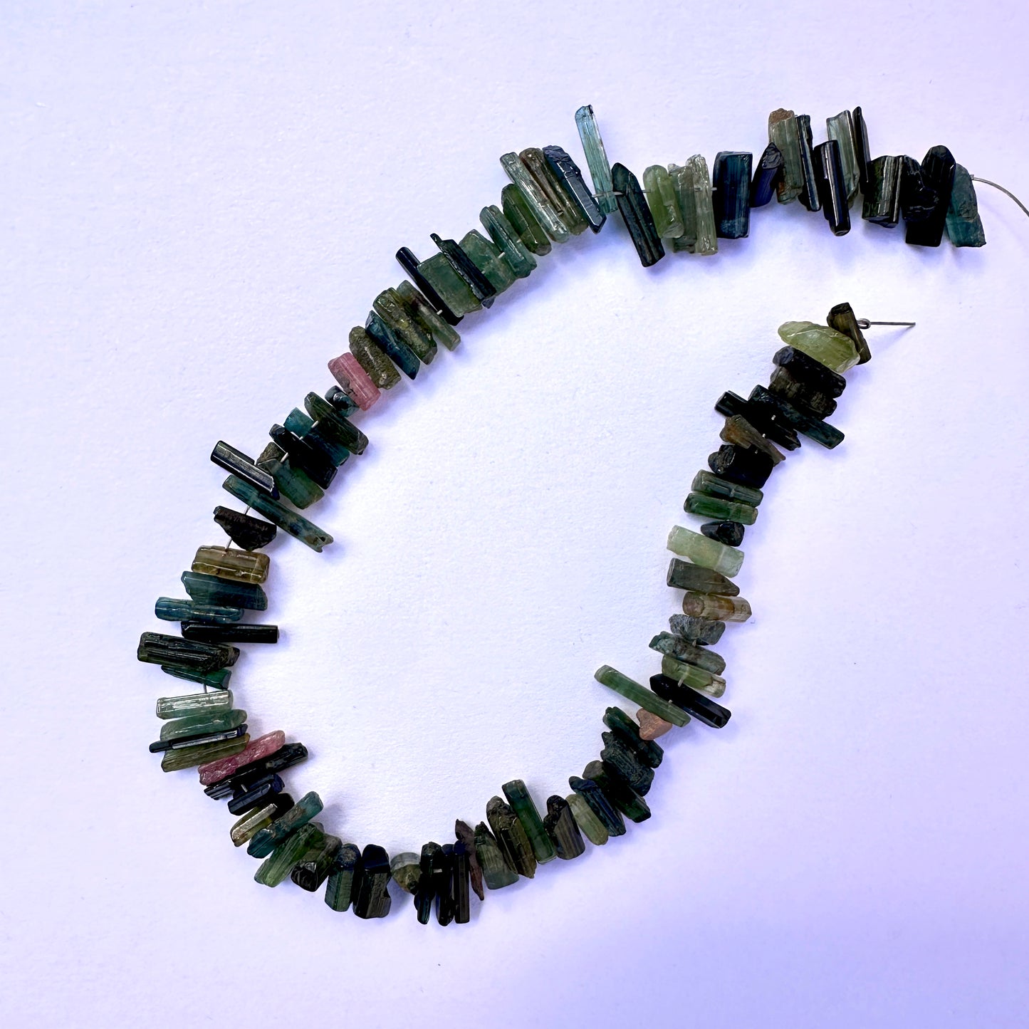 Handmade jewellery components featuring Multi Tourmaline beads with organic shapes and vibrant colours.