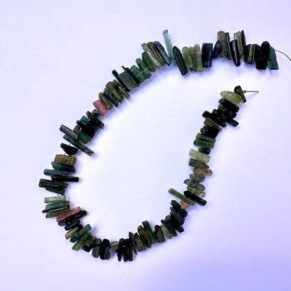 Handmade jewellery components featuring Multi Tourmaline beads with organic shapes and vibrant colours.
