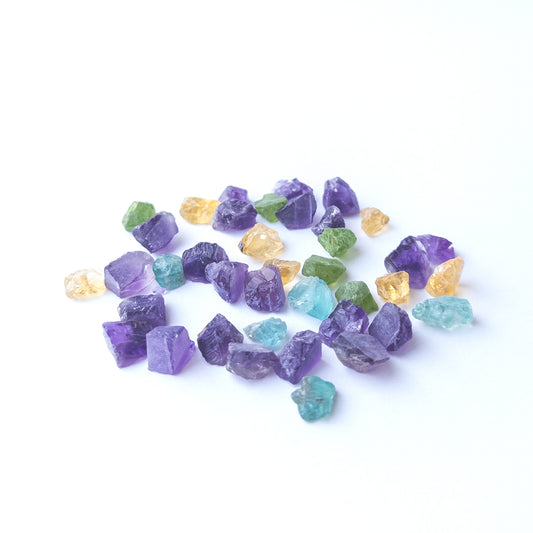 Premium undrilled Amethyst, Citrine, Apatite and Peridot rough stones with organic shapes.