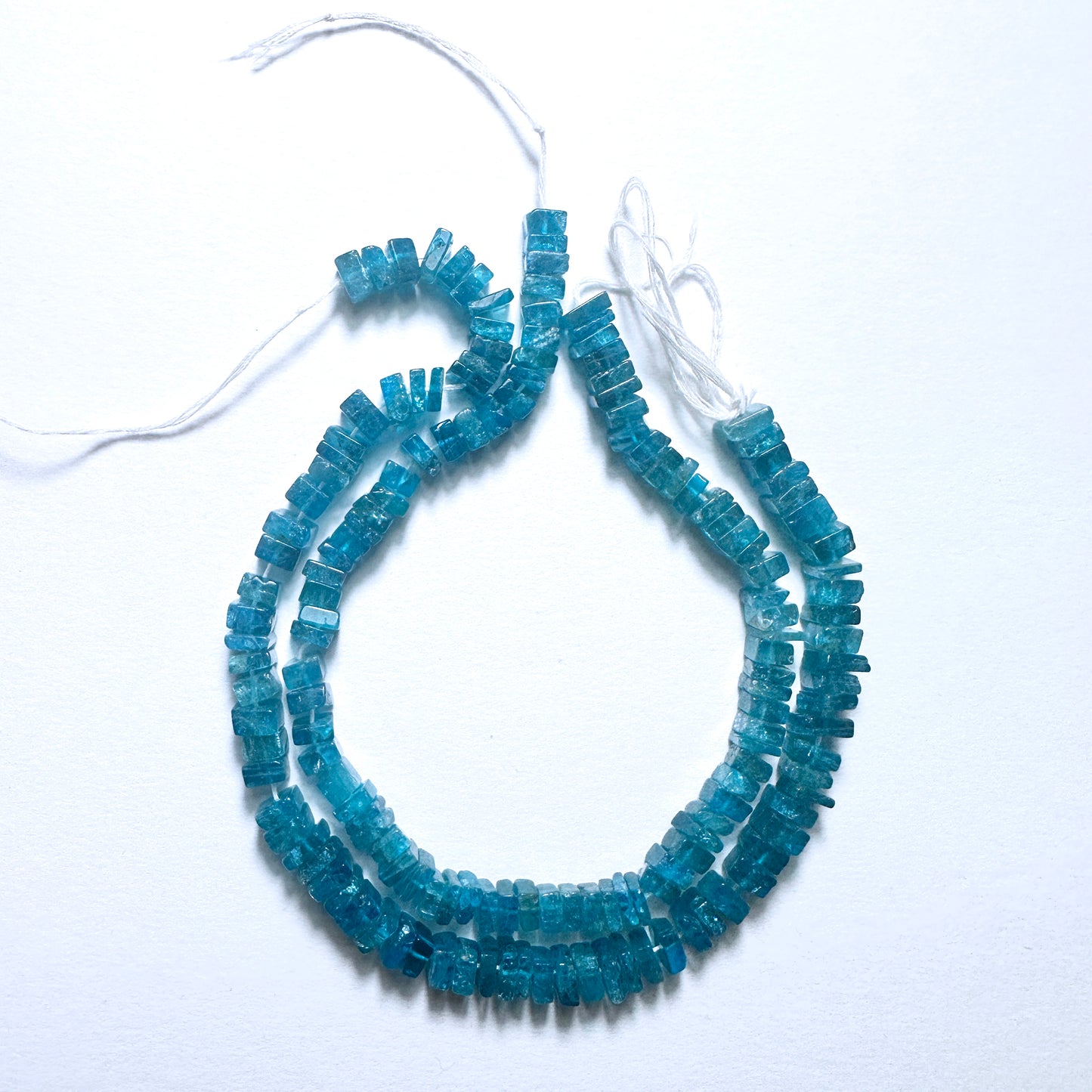Handmade jewellery components with Neon Apatite beads in smooth square cut, perfect for layering and custom styling.