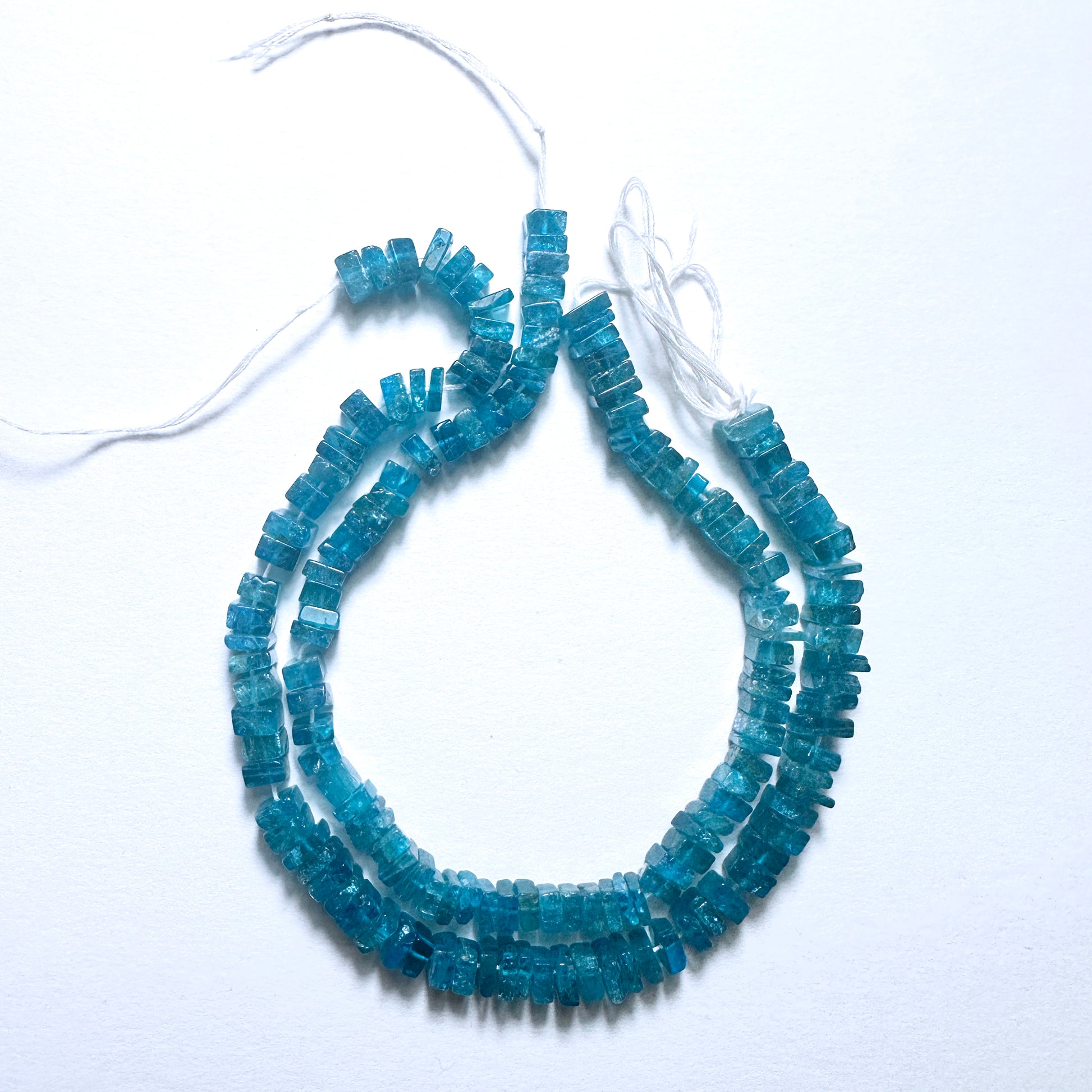 Handmade jewellery components with Neon Apatite beads in smooth square cut, perfect for layering and custom styling.
