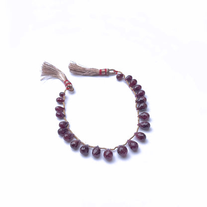 Premium gemstone beads for DIY jewellery showcasing ruby colour and cut.