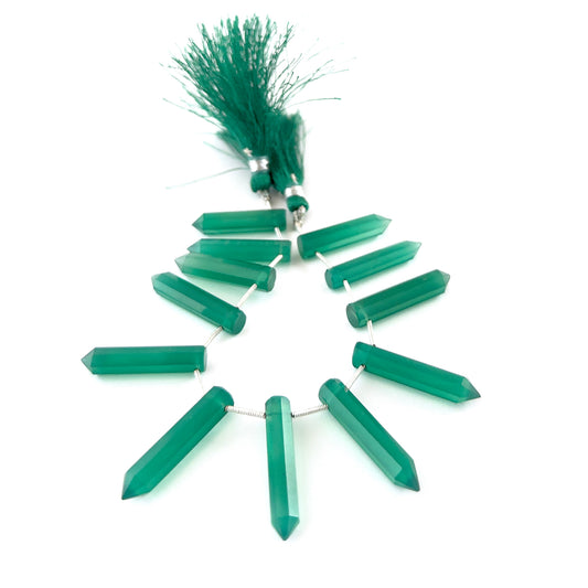 Green Onyx pencil‑cut briolettes featuring polished facets and rich translucent green tones across 12 pieces.