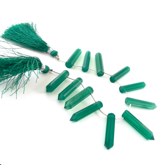 Green Onyx faceted pencil briolette beads sized 5.5–6mm, a 12‑piece set with vivid green colour and sharp faceting.