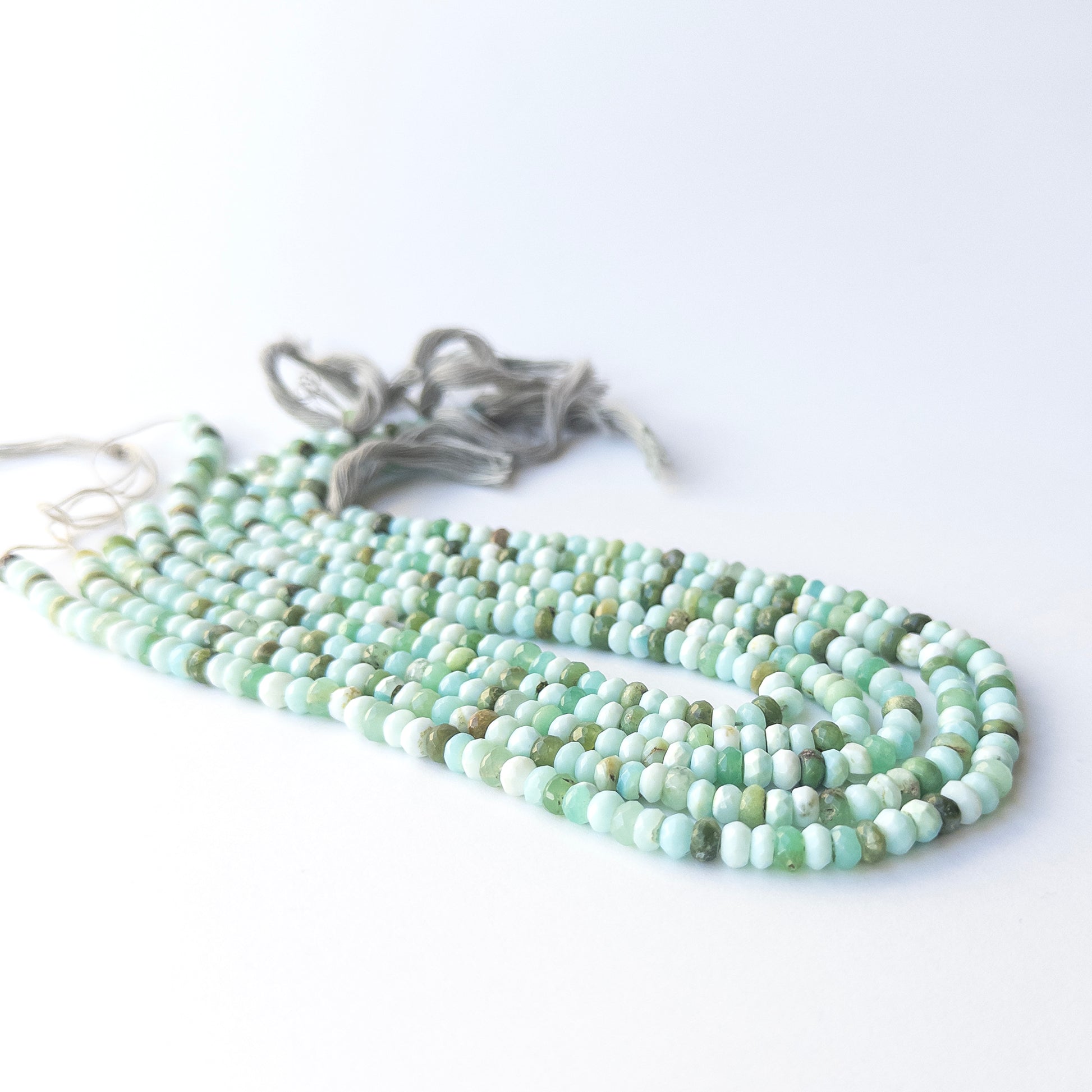 Authentic Mint Green Opal gemstone beads showing subtle shimmer and sparkle for artisan beadwork.