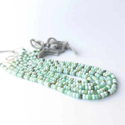 Authentic Mint Green Opal gemstone beads showing subtle shimmer and sparkle for artisan beadwork.