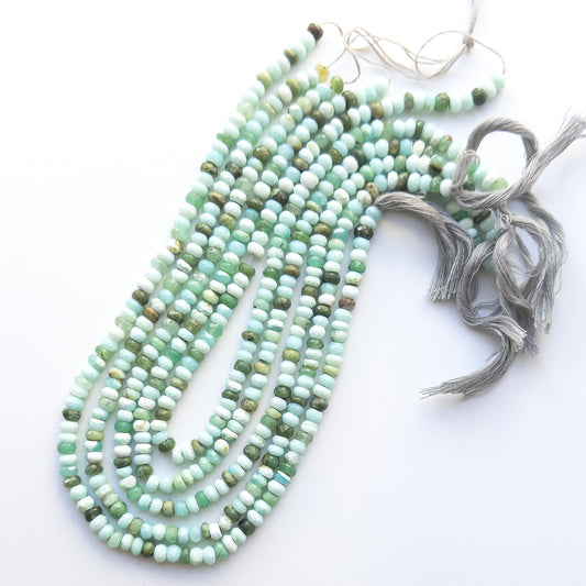 High‑quality Mint Green Opal rondelle beads arranged neatly for gemstone jewellery making.