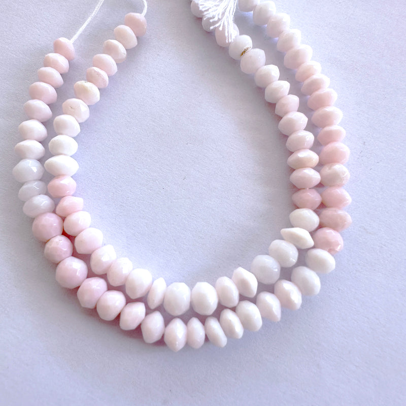 Close-up of shimmering Opal rondelle beads with precision faceting and natural colour variation.