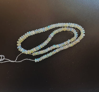 High-quality Opal rondelles with 0.5mm bead holes and radiant colour variation.