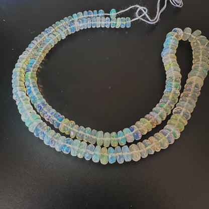 Natural Opal gemstone beads with faceted rondelle cut and luxurious finish.