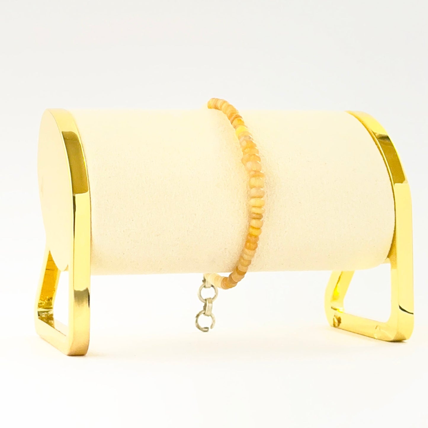 Elegant smooth rondelle opal bracelet crafted in a single adjustable strand.