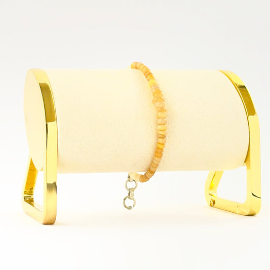 Elegant smooth rondelle opal bracelet crafted in a single adjustable strand.