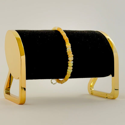 Smooth rondelle opal bracelet arranged in a classic 17cm layout.