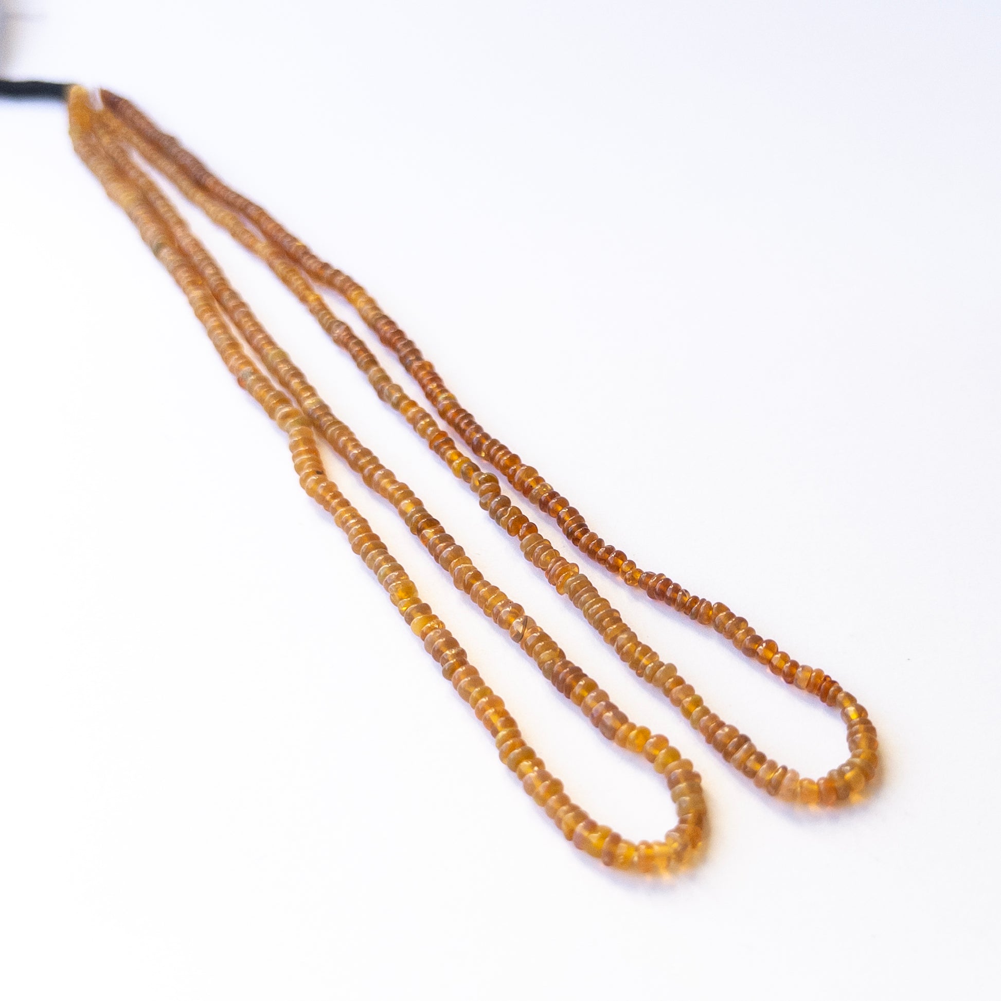 Genuine Opal gemstone beads in smooth rondelle shape, displaying polish, colour, and natural beauty for jewellery crafting.