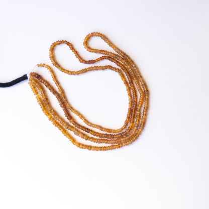 Opal smooth rondelle beads with natural variation, perfect for handmade jewellery components and creative beadwork.