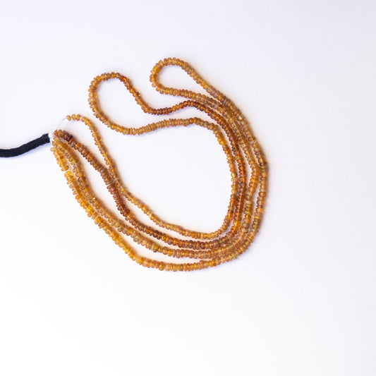 Opal smooth rondelle beads with natural variation, perfect for handmade jewellery components and creative beadwork.