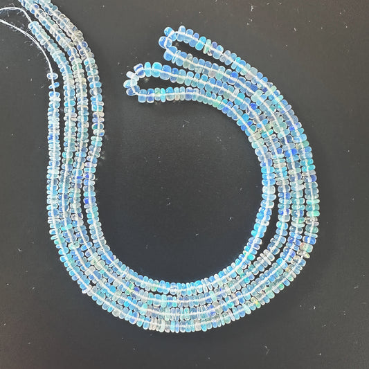 Opal smooth rondelle beads with soft pastel hues and glossy finish on a 42cm strand.