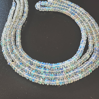 Natural Opal gemstone beads with smooth rondelle cut and luminous pastel tones.