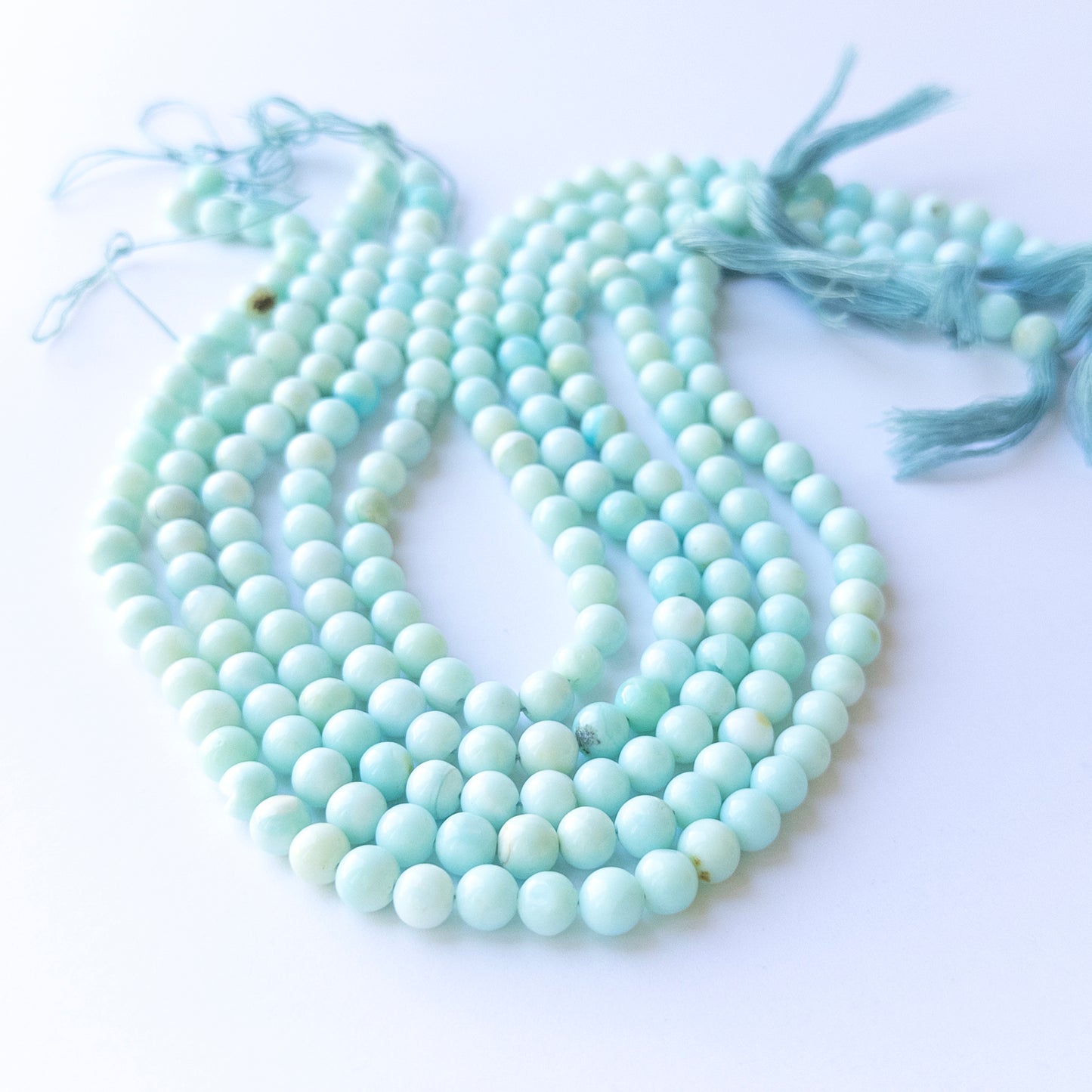 Opal smooth round beads in 6.8–7mm size on a 31cm strand, showcasing natural gemstone glow for handmade jewellery.