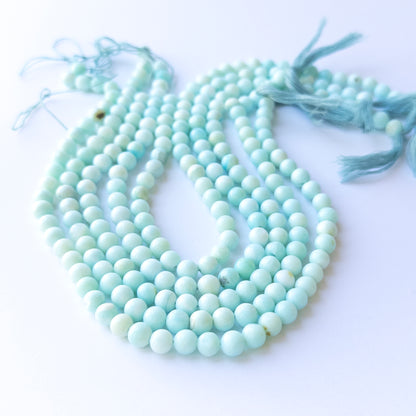 Opal smooth round beads in 6.8–7mm size on a 31cm strand, showcasing natural gemstone glow for handmade jewellery.