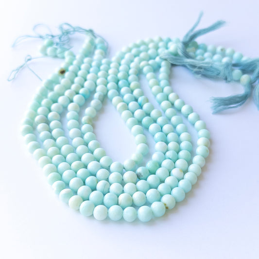 Opal smooth round beads in 6.8–7mm size on a 31cm strand, showcasing natural gemstone glow for handmade jewellery.