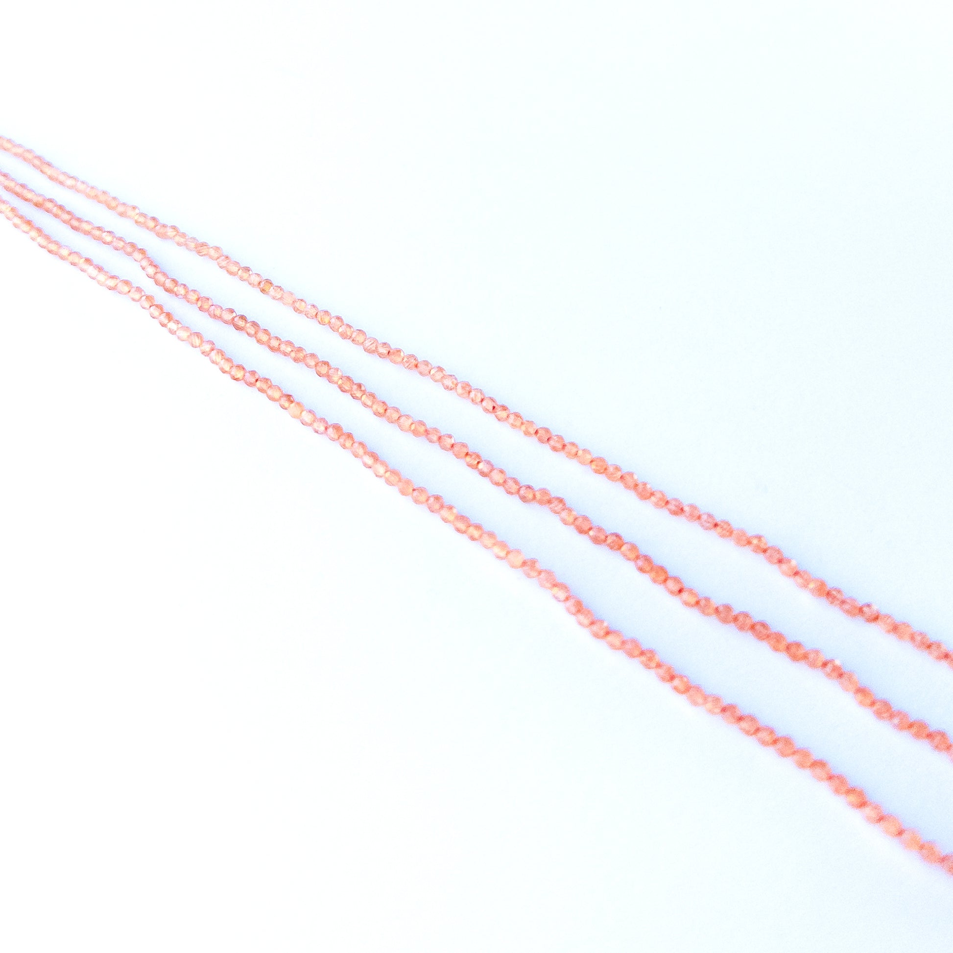 Handmade jewellery components featuring authentic Orange Chalcedony faceted rondelle beads with warm sparkle.