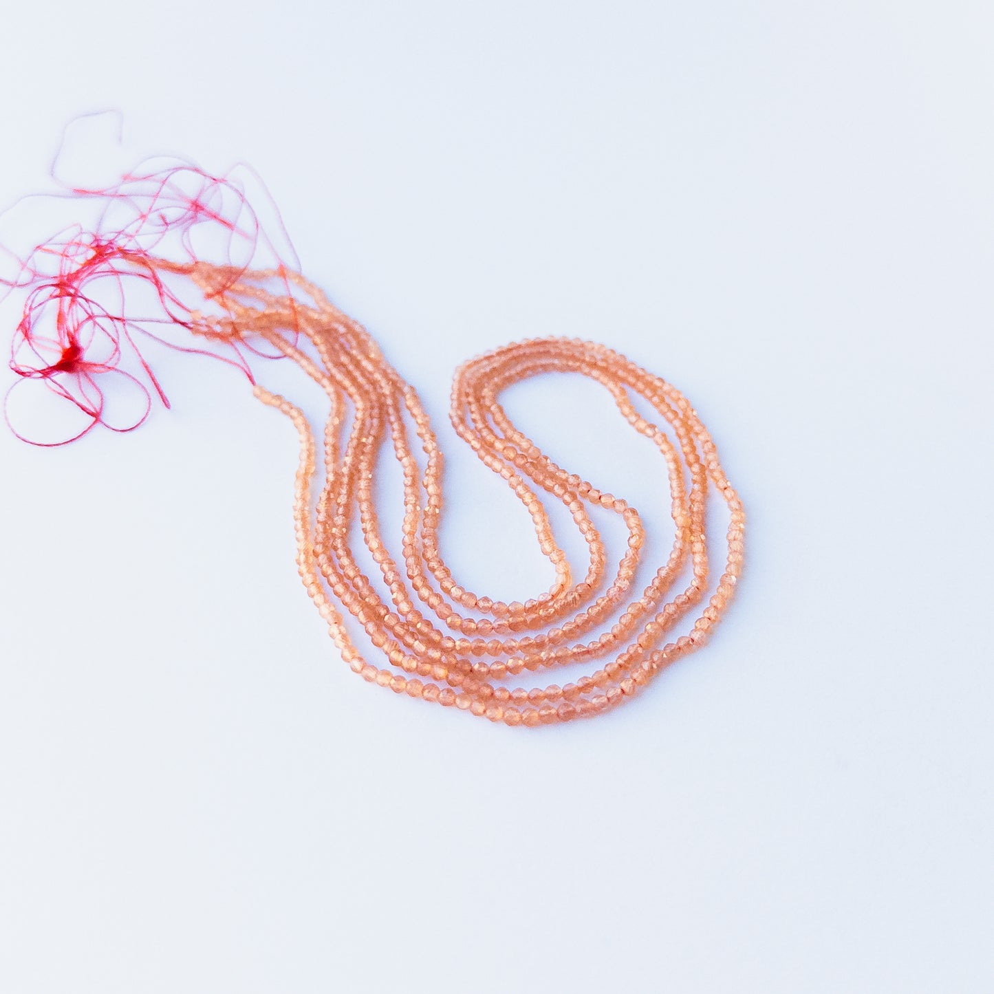 Vibrant Orange Chalcedony faceted rondelle stone beads 2.2mm displayed neatly for DIY jewellery and authentic gemstone designs.