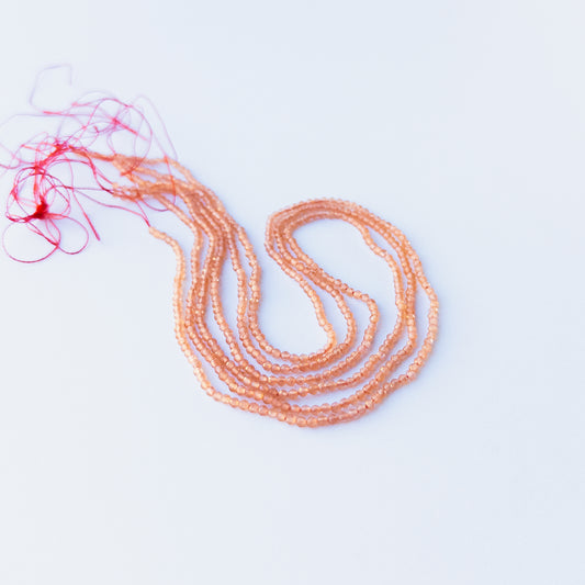 Vibrant Orange Chalcedony faceted rondelle stone beads 2.2mm displayed neatly for DIY jewellery and authentic gemstone designs.