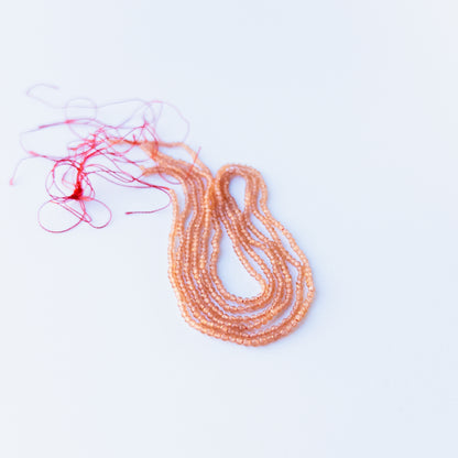Orange Chalcedony faceted rondelle 2.2mm genuine gemstone beads arranged in a bright 36cm strand for handmade jewellery.