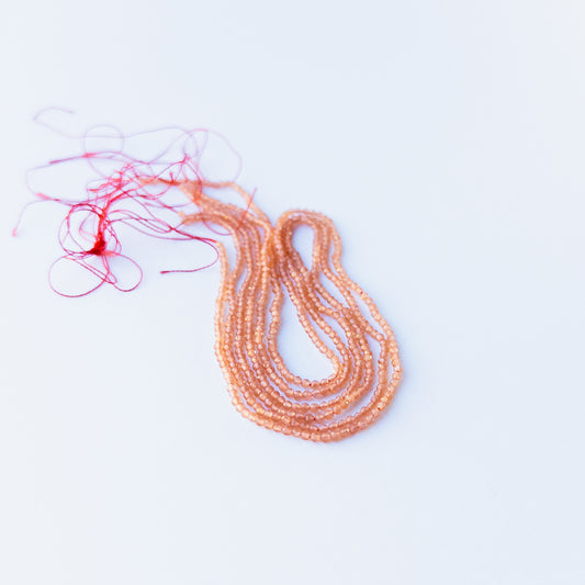 Orange Chalcedony faceted rondelle 2.2mm genuine gemstone beads arranged in a bright 36cm strand for handmade jewellery.