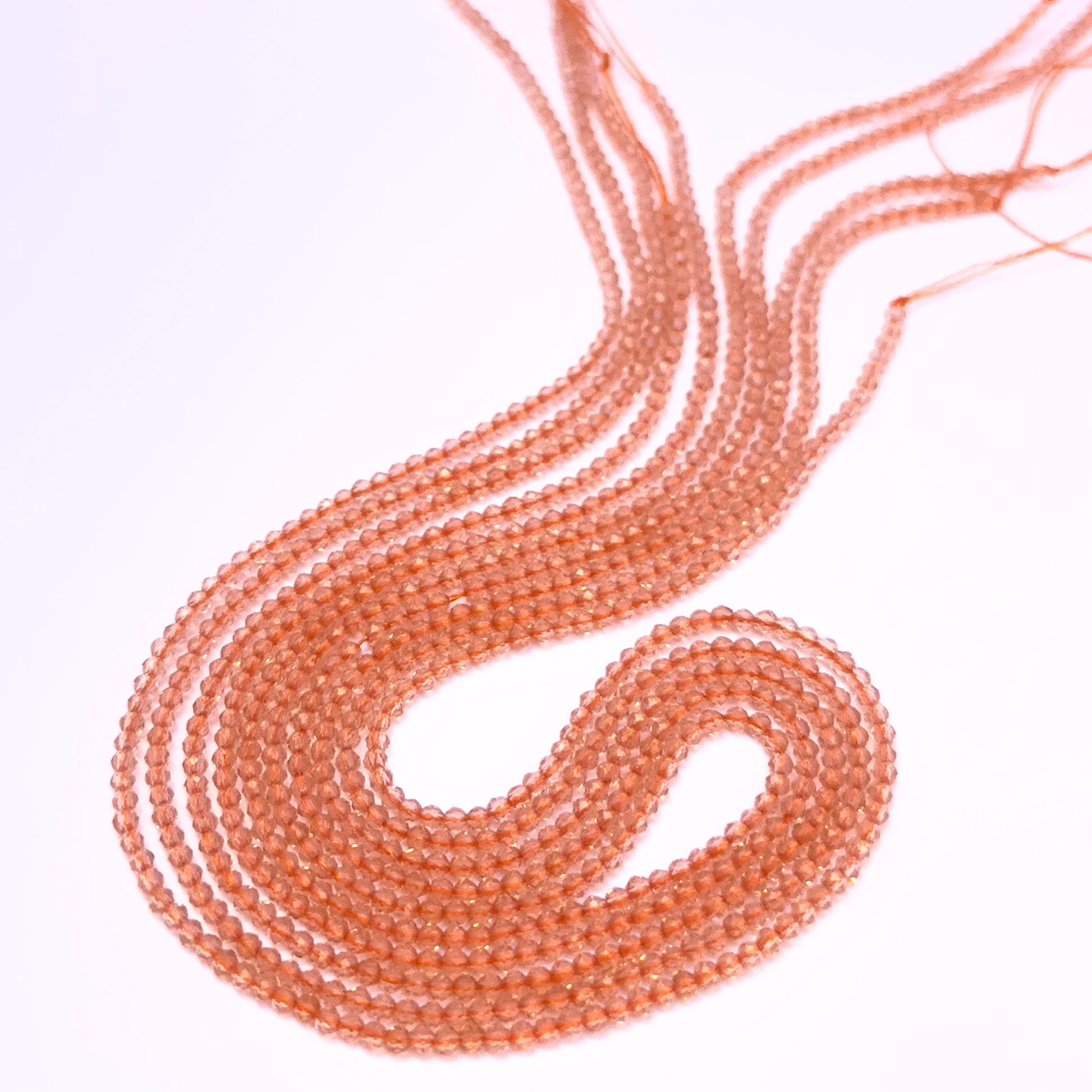 Orange Quartz faceted rondelle beads in warm orange tones strung on a 35cm strand.