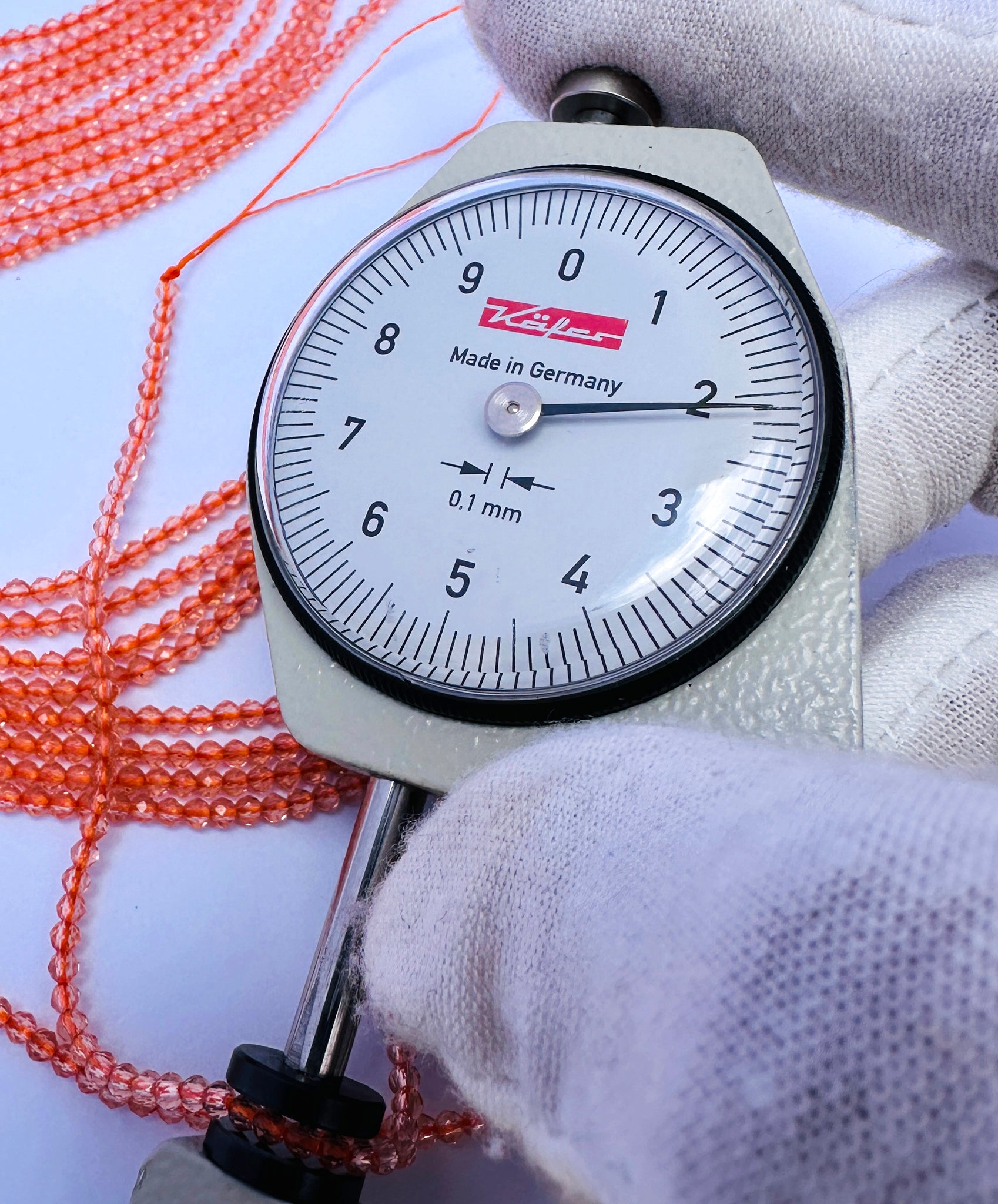Handmade jewellery components featuring Orange Quartz faceted rondelle beads.