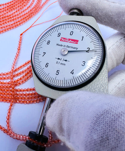 Handmade jewellery components featuring Orange Quartz faceted rondelle beads.