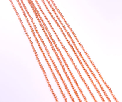 A dial gauge measures the Orange Quartz faceted rondelle 2.1mm gemstone.