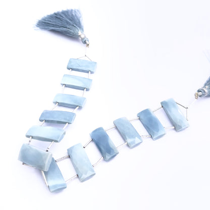 Natural Owyhee Opal stone beads arranged in a strand with elegant sparkle.