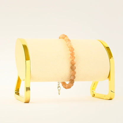 Elegant peach moonstone bracelet crafted with smooth round beads.