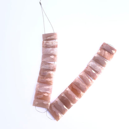 Close‑up of Peach Moonstone rectangle beads showing their shimmer and faceted cut.