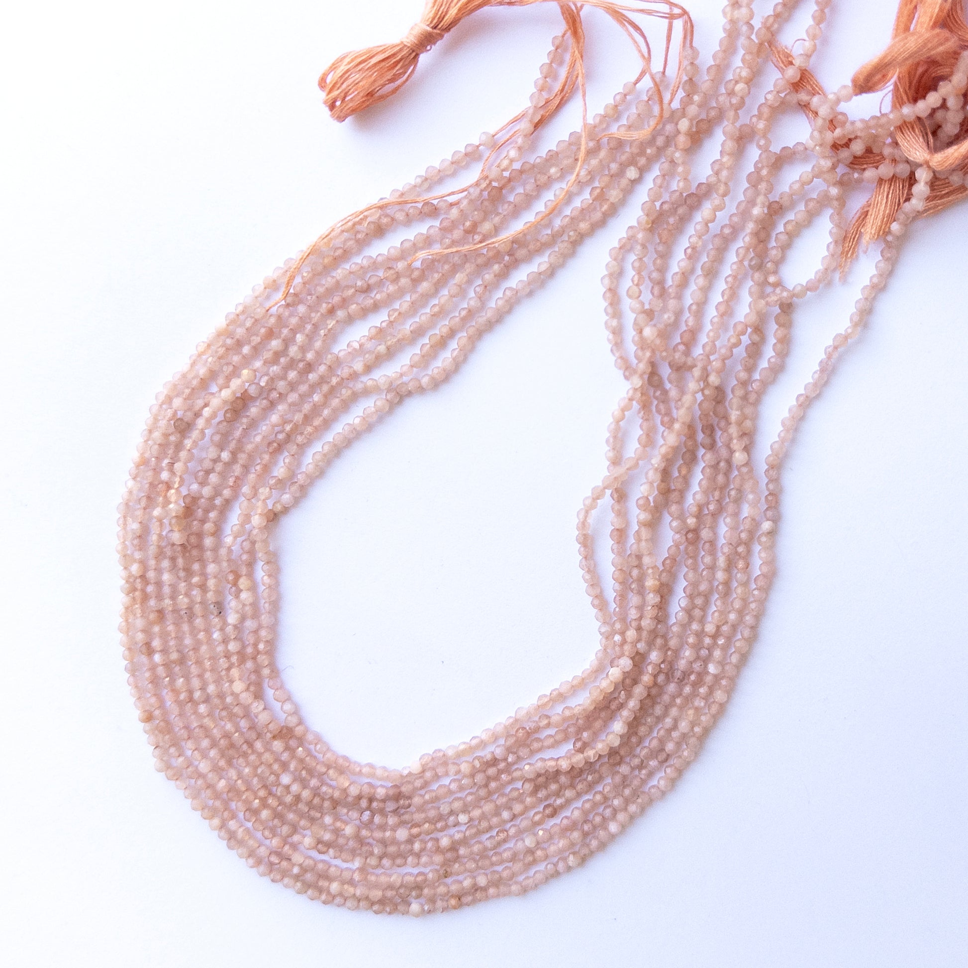 Authentic Peach Moonstone stone beads with faceted rondelle cut, ideal for DIY jewellery makers seeking premium gemstone components.