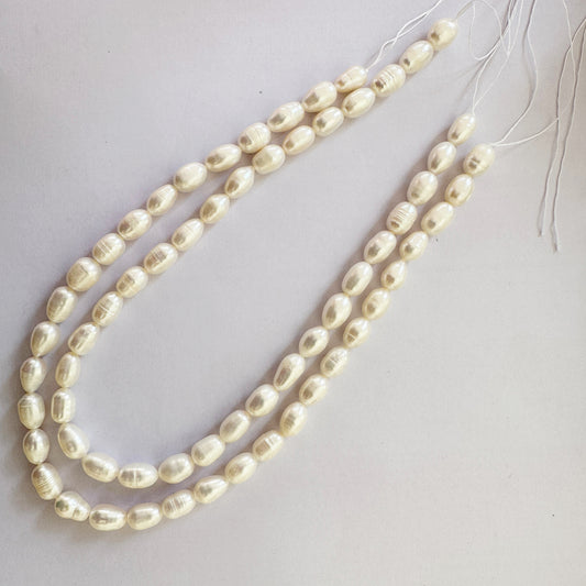 Natural oval pearls with soft textured surfaces and ivory lustre on a 33cm strand.