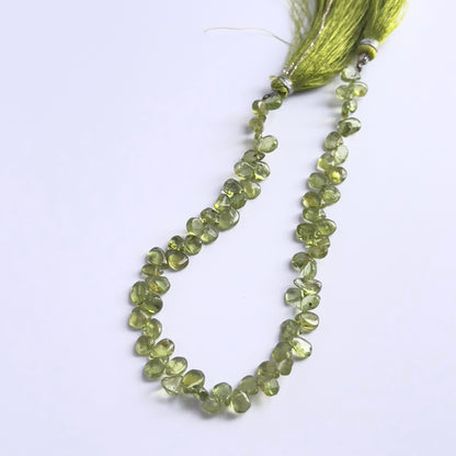 Natural gemstone beads for DIY jewellery, Peridot smooth drops with luminous green hues.