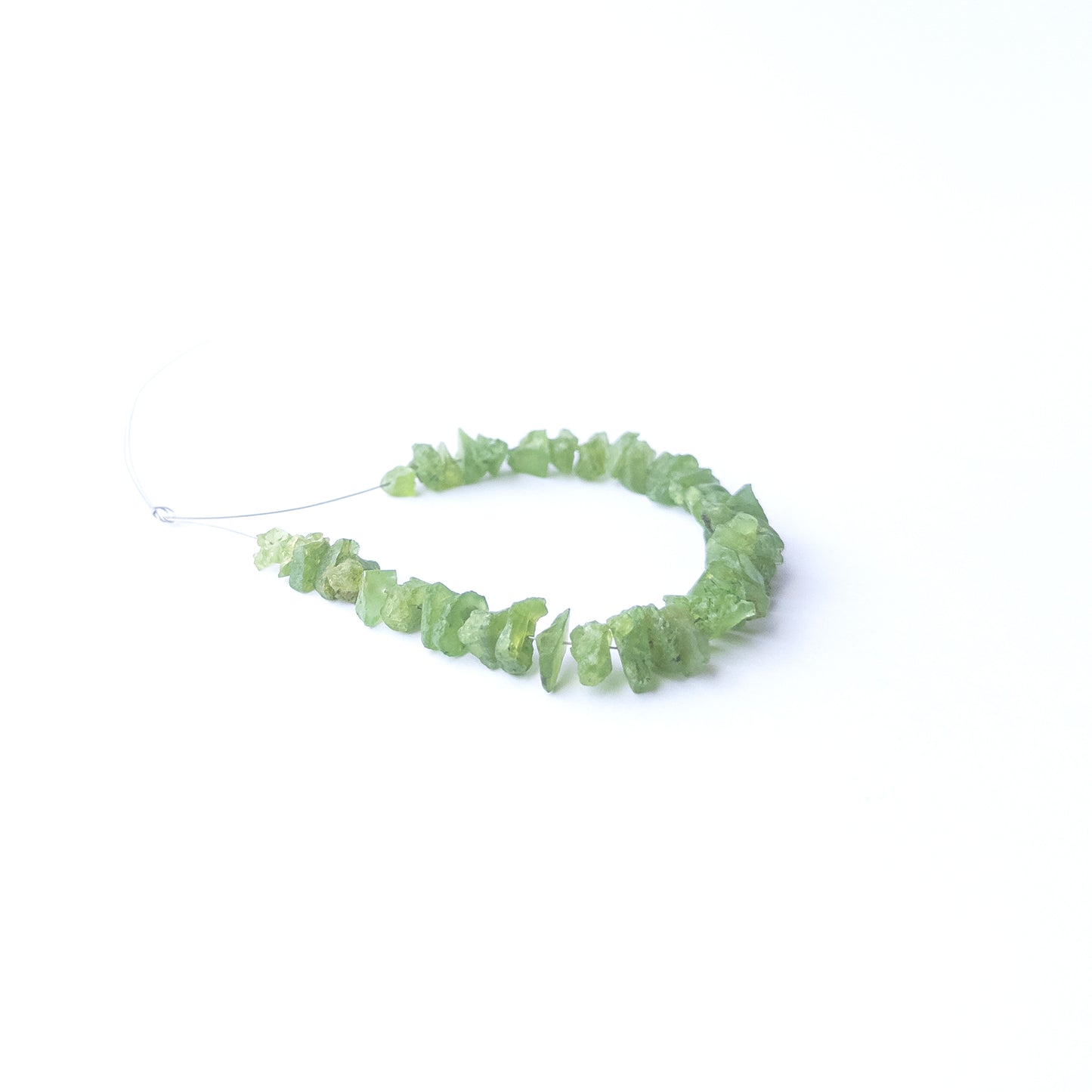 High‑quality Peridot drilled rough beads with lively green shine ideal for handmade jewellery components.