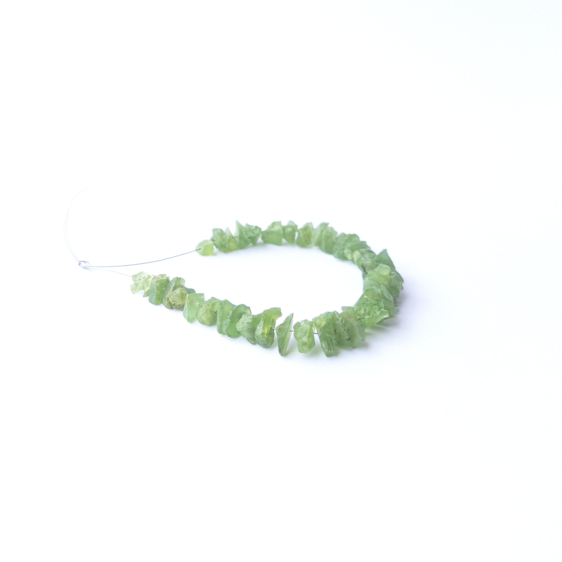 High‑quality Peridot drilled rough beads with lively green shine ideal for handmade jewellery components.