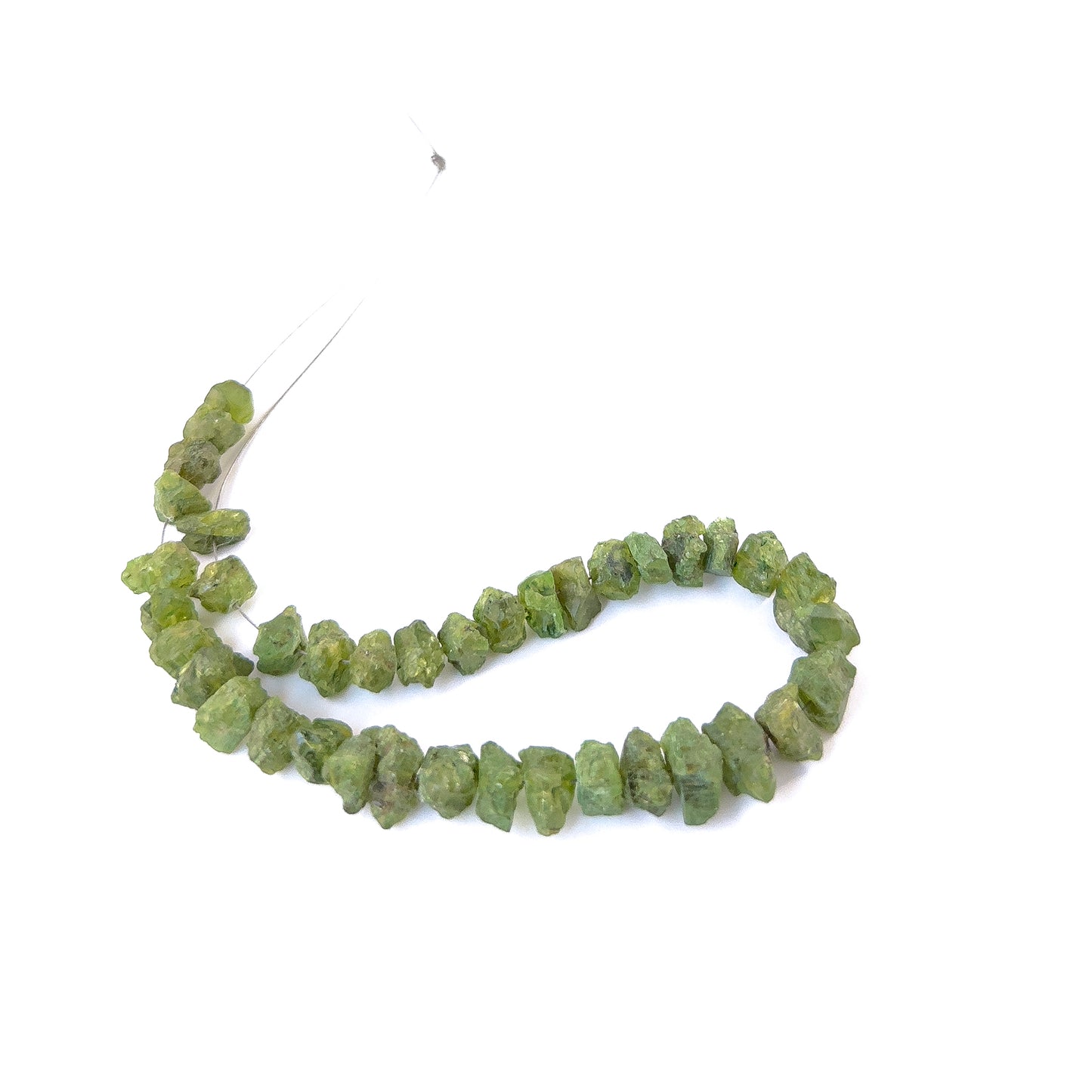 Premium Peridot rough beads showcasing natural texture and vibrant green colour for artisan jewellery designs.