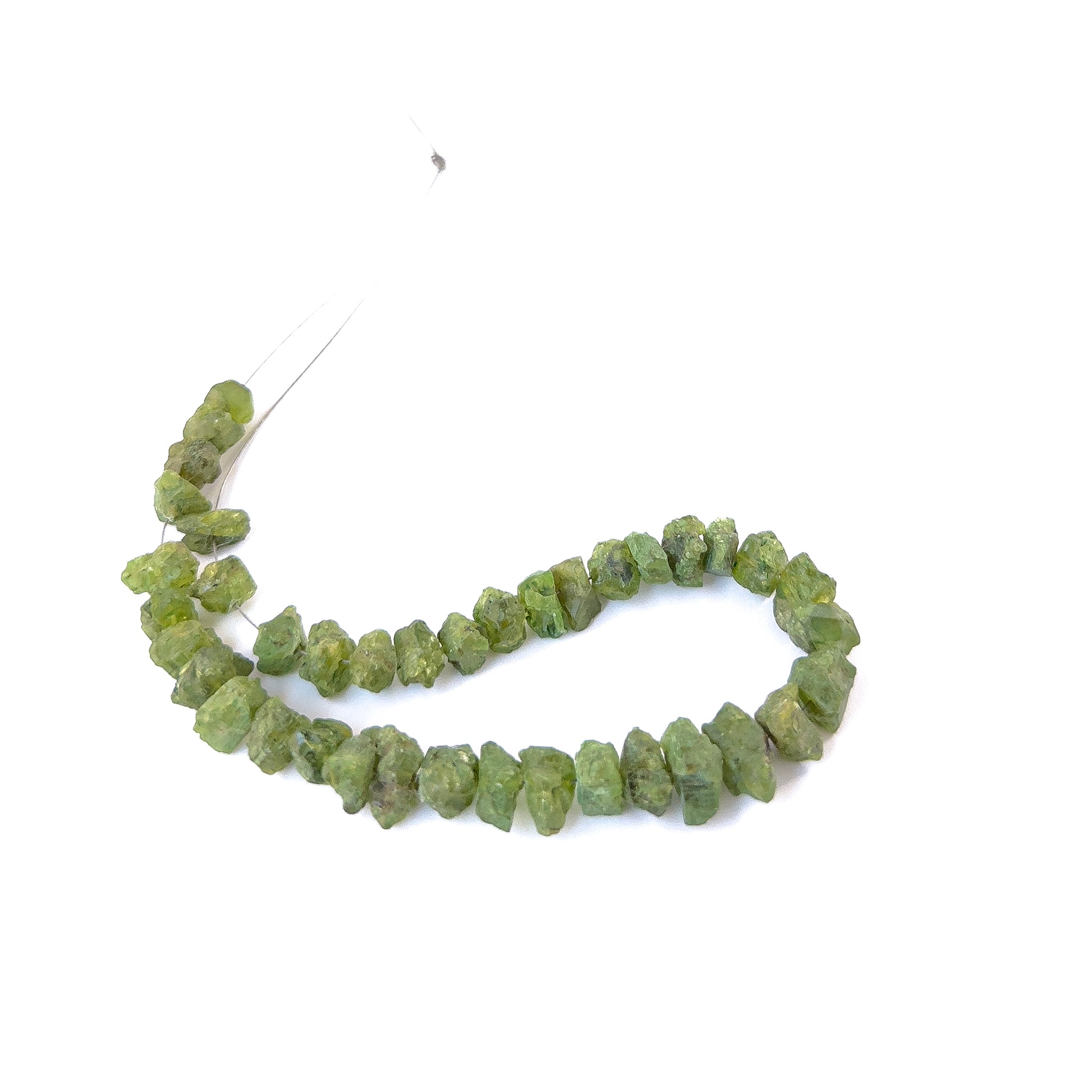 Premium Peridot rough beads showcasing natural texture and vibrant green colour for artisan jewellery designs.