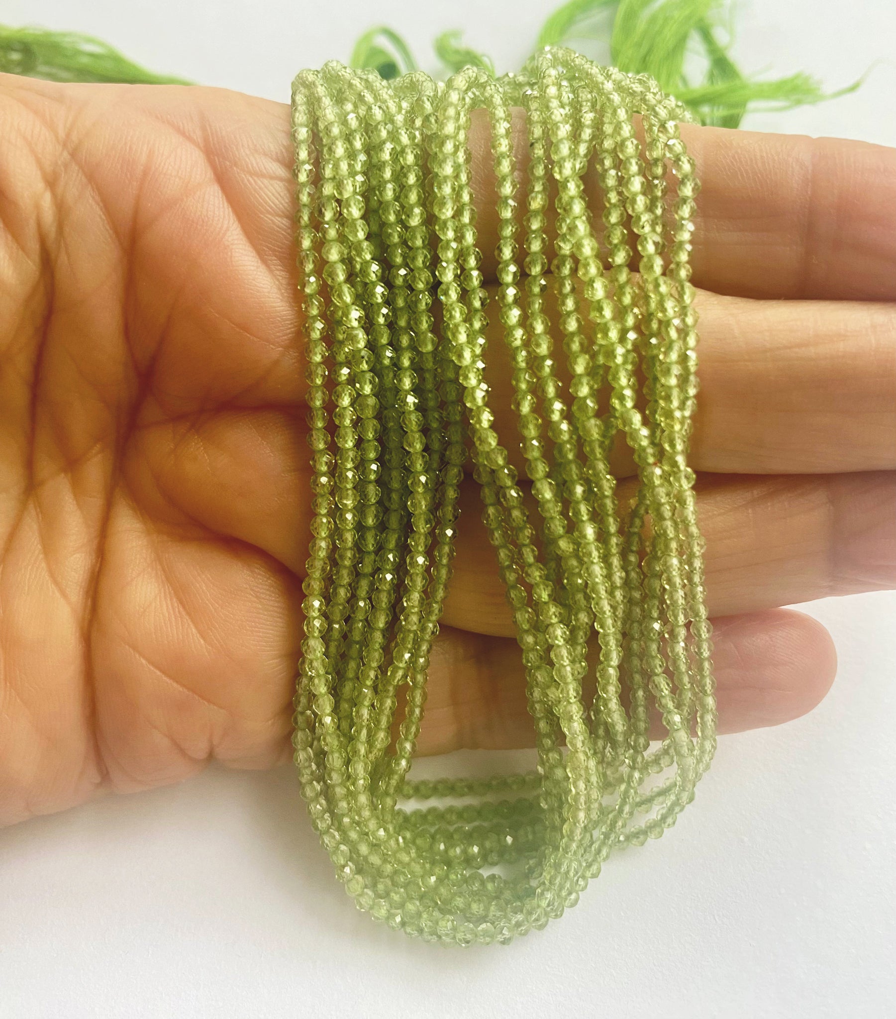 Lustrous faceted Peridot rondelle stones with subtle colour variation and fine clarity.