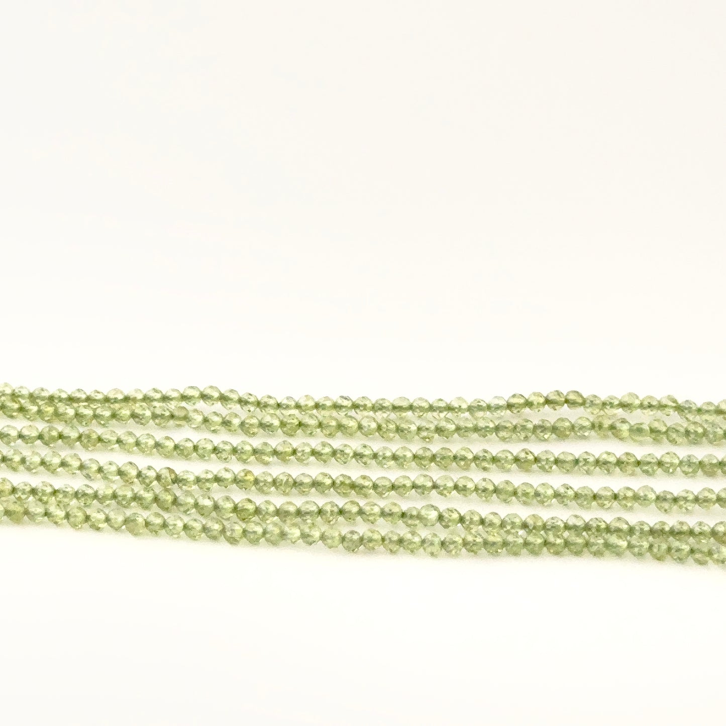Authentic Peridot gemstone beads, 2.1–2.2mm faceted rondelles with bright green sparkle for DIY jewellery makers.